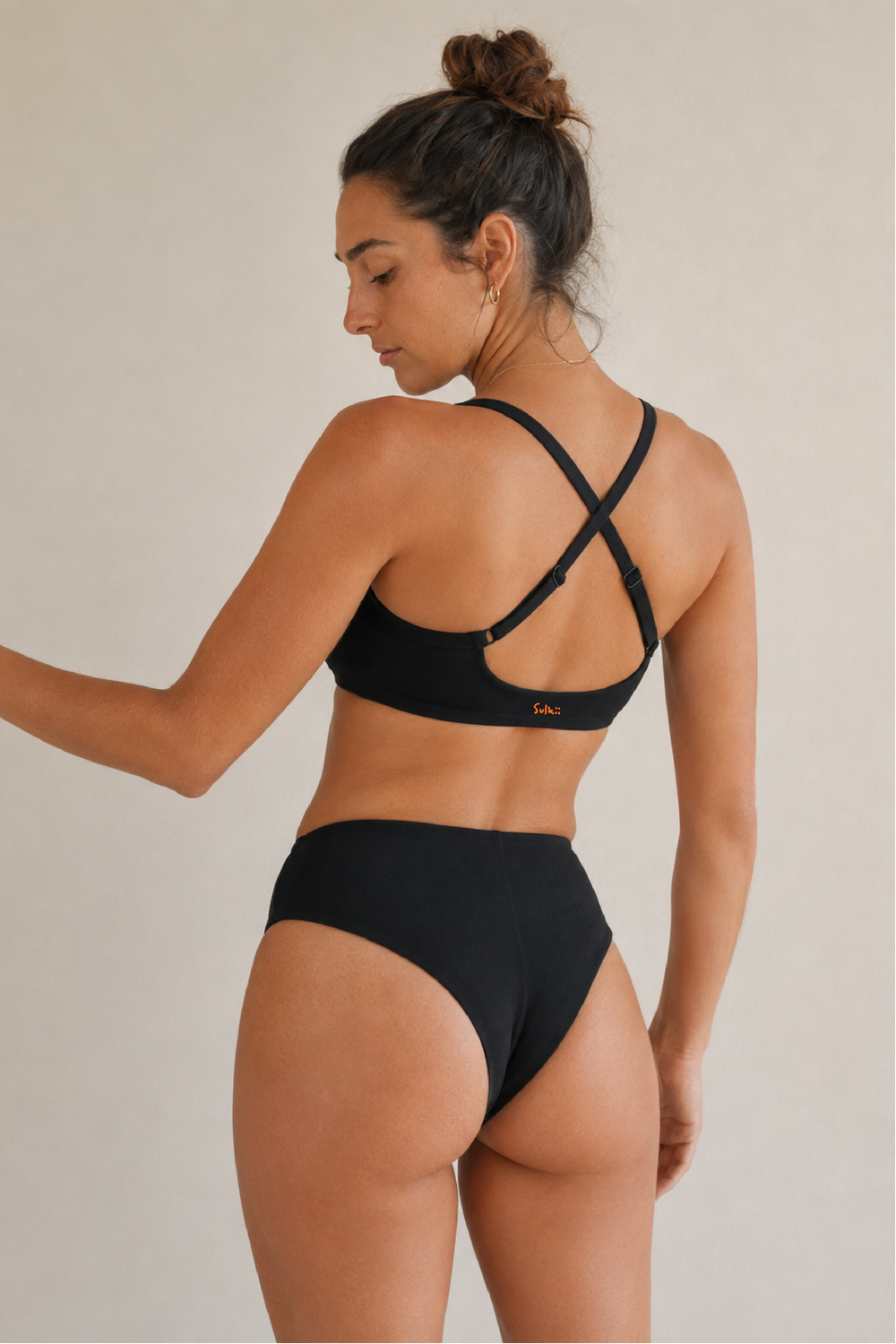 Sulkii Drew Cross Back Bra shown from a back-side angle with the Drew High Waist Brief.